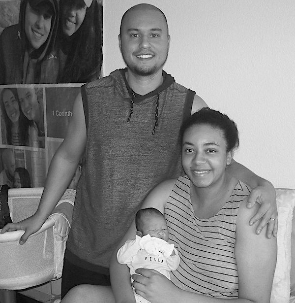 Beautiful Births couple holding new baby after homebirth.